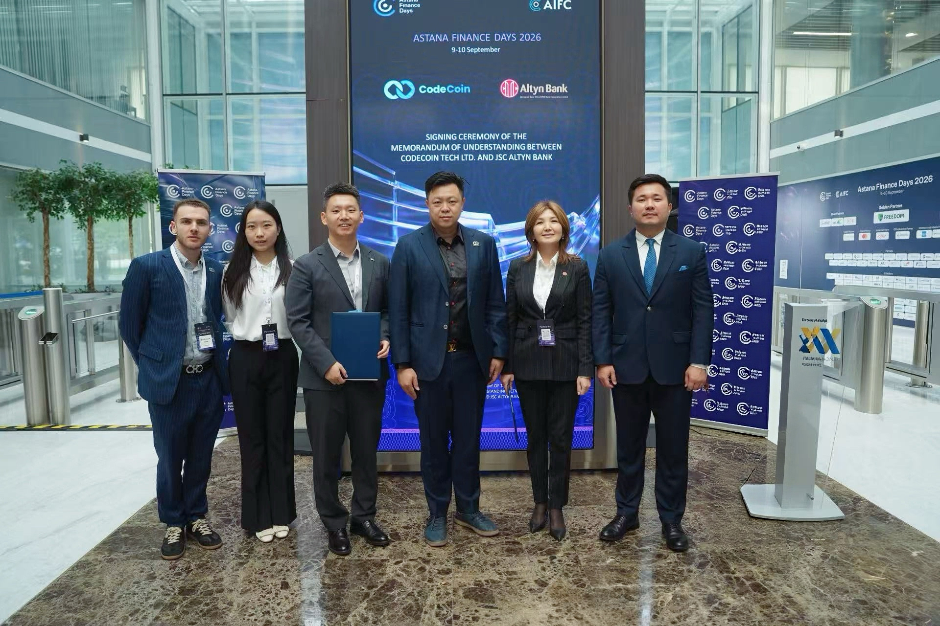 Group photo at the memorandum of understanding signing ceremony between CodeCoin Tech Ltd. and JSC Altyn Bank at Astana Finance Days 2026.